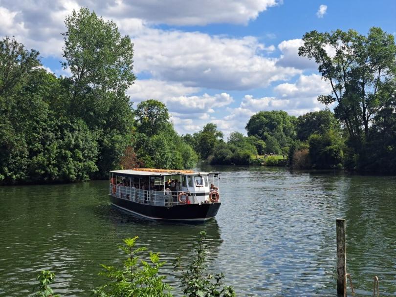 Alexandra boat floating in the middle of river