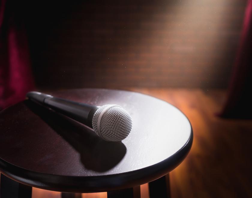 microphone on stool at comedy club