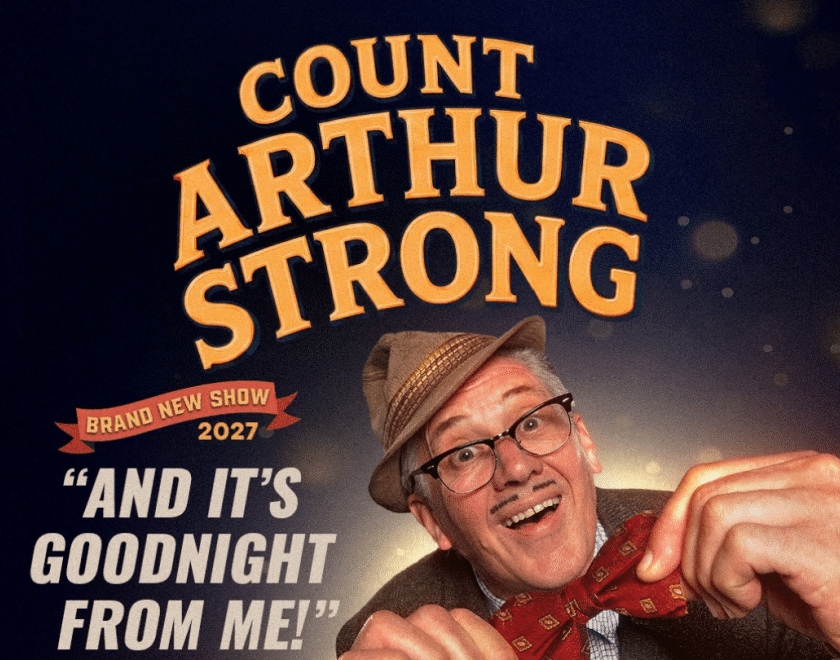 Count Arthur Strong wearing a hat and a bow tie