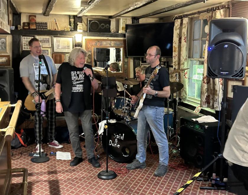 pub rock band playing rock in a pub