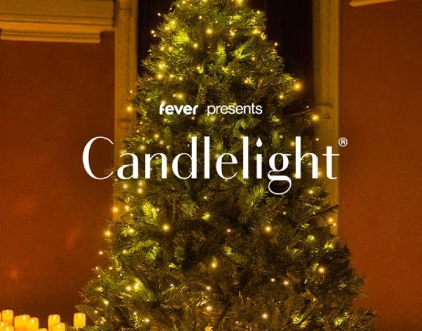 The words "fever presents Candlelight" over an image of a Christmas tree